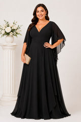 Front view of the Nala black plus size formal chiffon maxi dress with V-neckline, angel sleeves and flowing layered skirt.