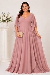 Front view of the Nala blush pink plus size formal chiffon maxi dress with V-neckline, angel sleeves and flowing layered skirt.