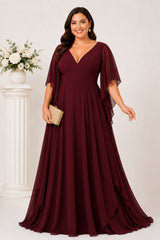 Front view of the Nala burgundy plus size formal chiffon maxi dress with V-neckline, angel sleeves and flowing layered skirt.