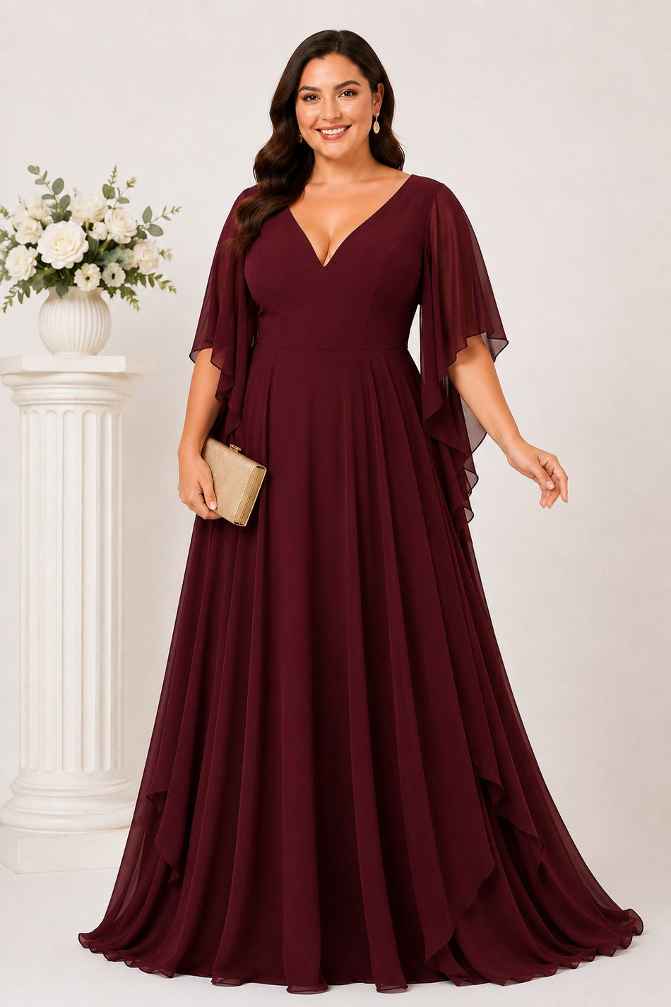 Front view of the Nala burgundy plus size formal chiffon maxi dress with V-neckline, angel sleeves and flowing layered skirt.