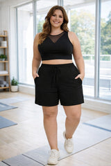 Plus size gym shorts with drawstring waistband and athletic stretch fabric in black