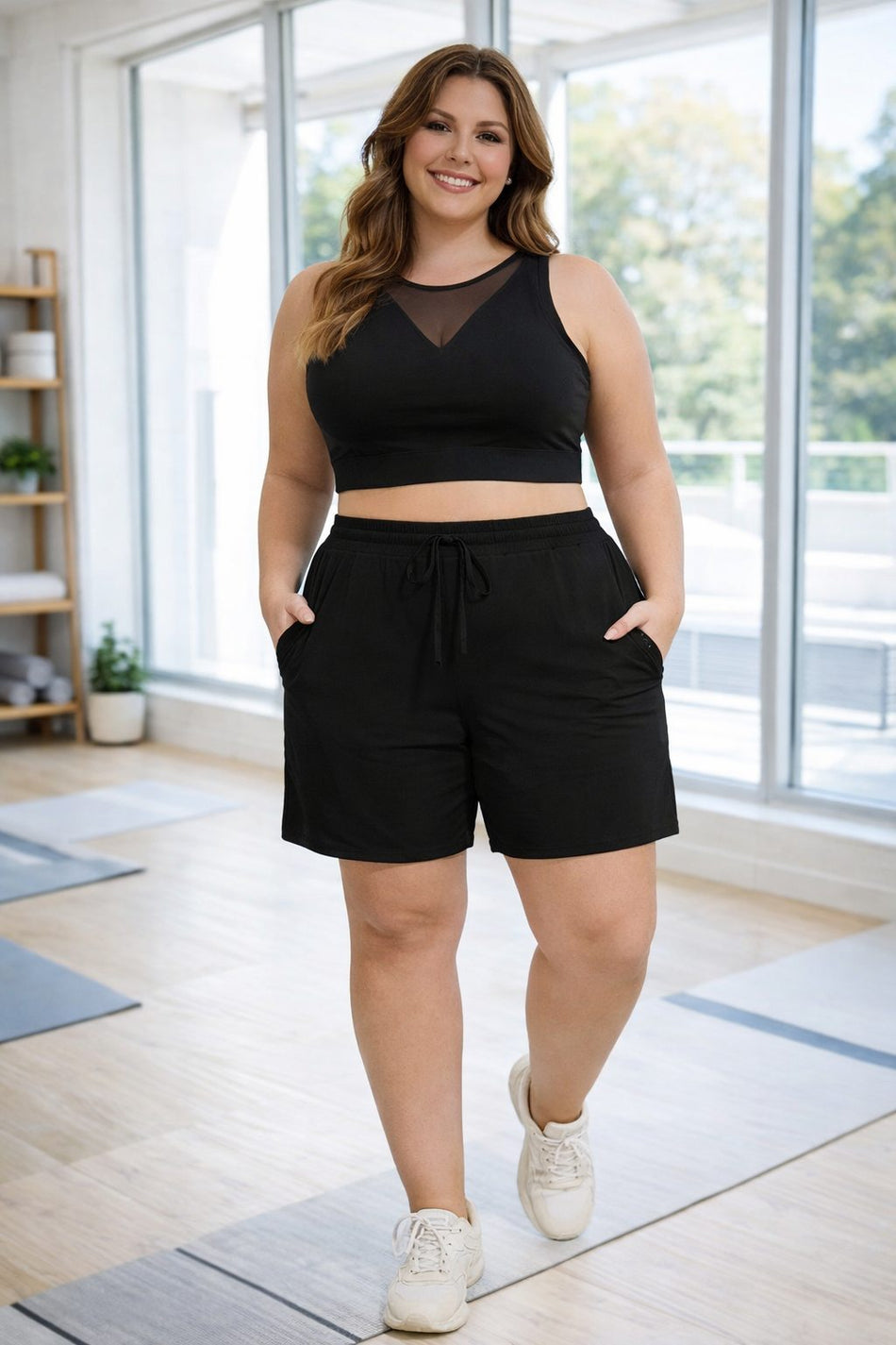 Plus size gym shorts with drawstring waistband and athletic stretch fabric in black