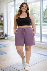 Plus size activewear workout shorts with elastic drawstring waistband and pockets in purple – Hello Curve