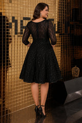 Back view of plus size black knee-length cocktail dress with subtle sparkle, sheer upper back, three-quarter sleeves and flattering A-line silhouette.