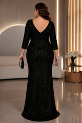 Plus size black sequin evening maxi dress with wrap V-neck, three-quarter sleeves, waist tie and front split, back view.