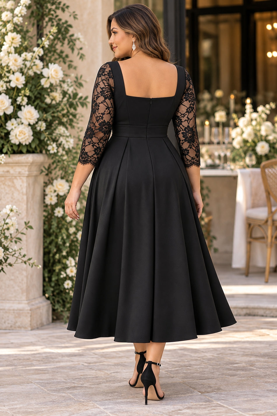 Back view of plus size black midi cocktail dress with square back neckline, lace sleeves and A-line skirt.