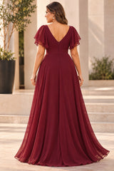 Back view of a burgundy chiffon evening dress with V-shaped back, flutter sleeves, defined waistband and floor-length skirt.
