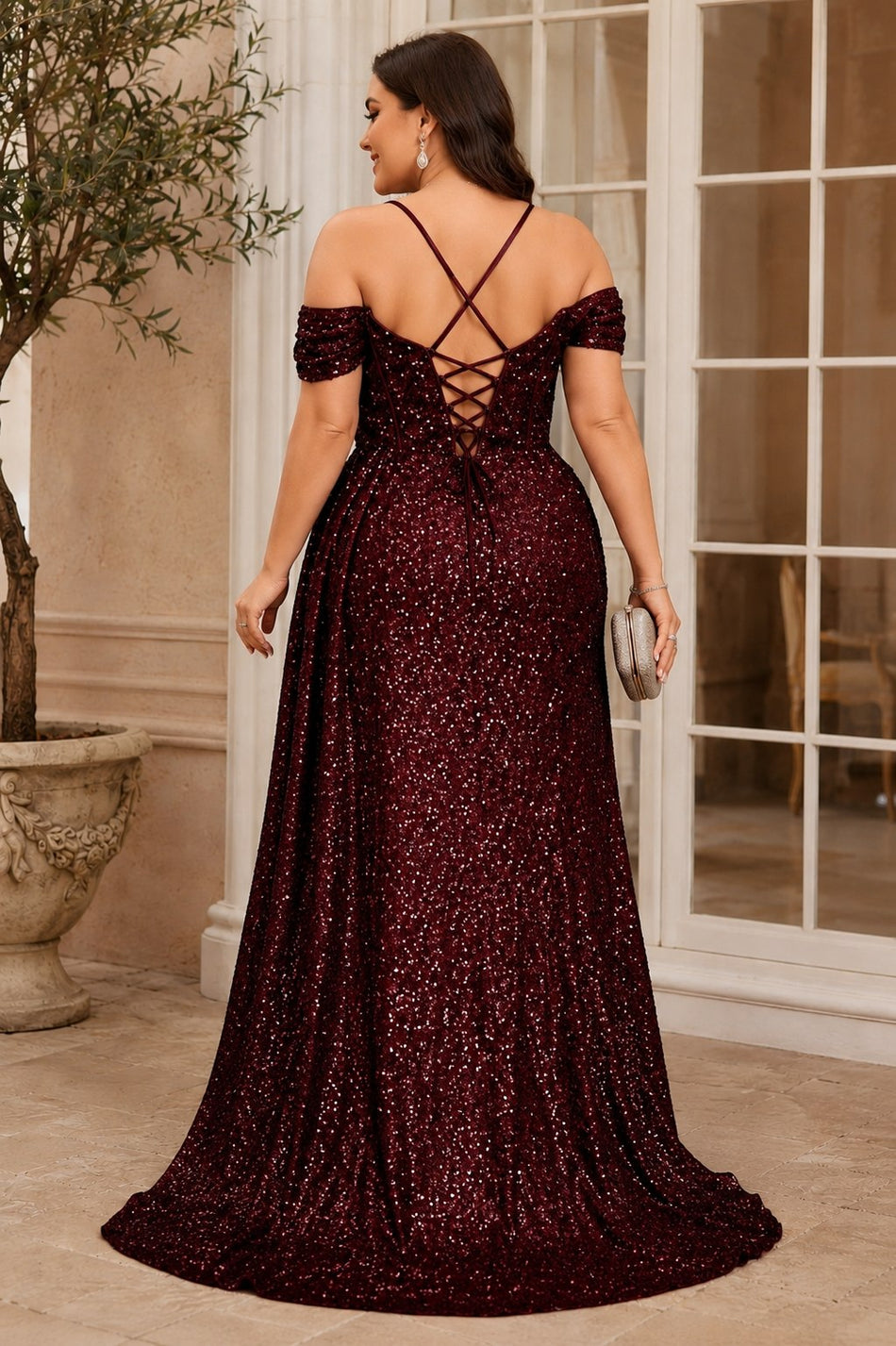 Back view of a plus size burgundy sequin formal dress featuring an elegant lace-up back.