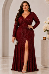 Plus size woman wearing a burgundy sequin evening dress with V neckline, long sleeves, gathered waist and front slit.
