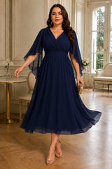 Plus size chiffon wedding guest dress with waterfall sleeves and crossover V-neck in navy blue