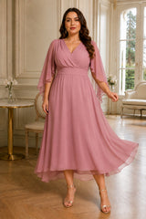 Plus size chiffon wedding guest dress with waterfall sleeves and crossover V-neck in dusty pink