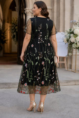 Plus size black embroidered floral midi dress with sheer short sleeves and V-neckline for formal events - back view