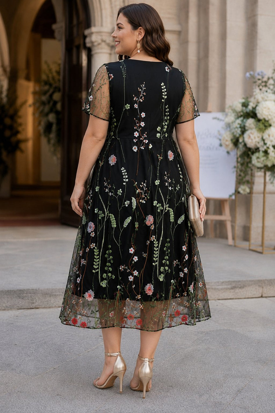 Plus size black embroidered floral midi dress with sheer short sleeves and V-neckline for formal events - back view