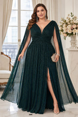Plus size emerald green evening dress with Grecian draped bodice, deep V-neckline, crossover waist, cape sleeves and flowing floor-length skirt.