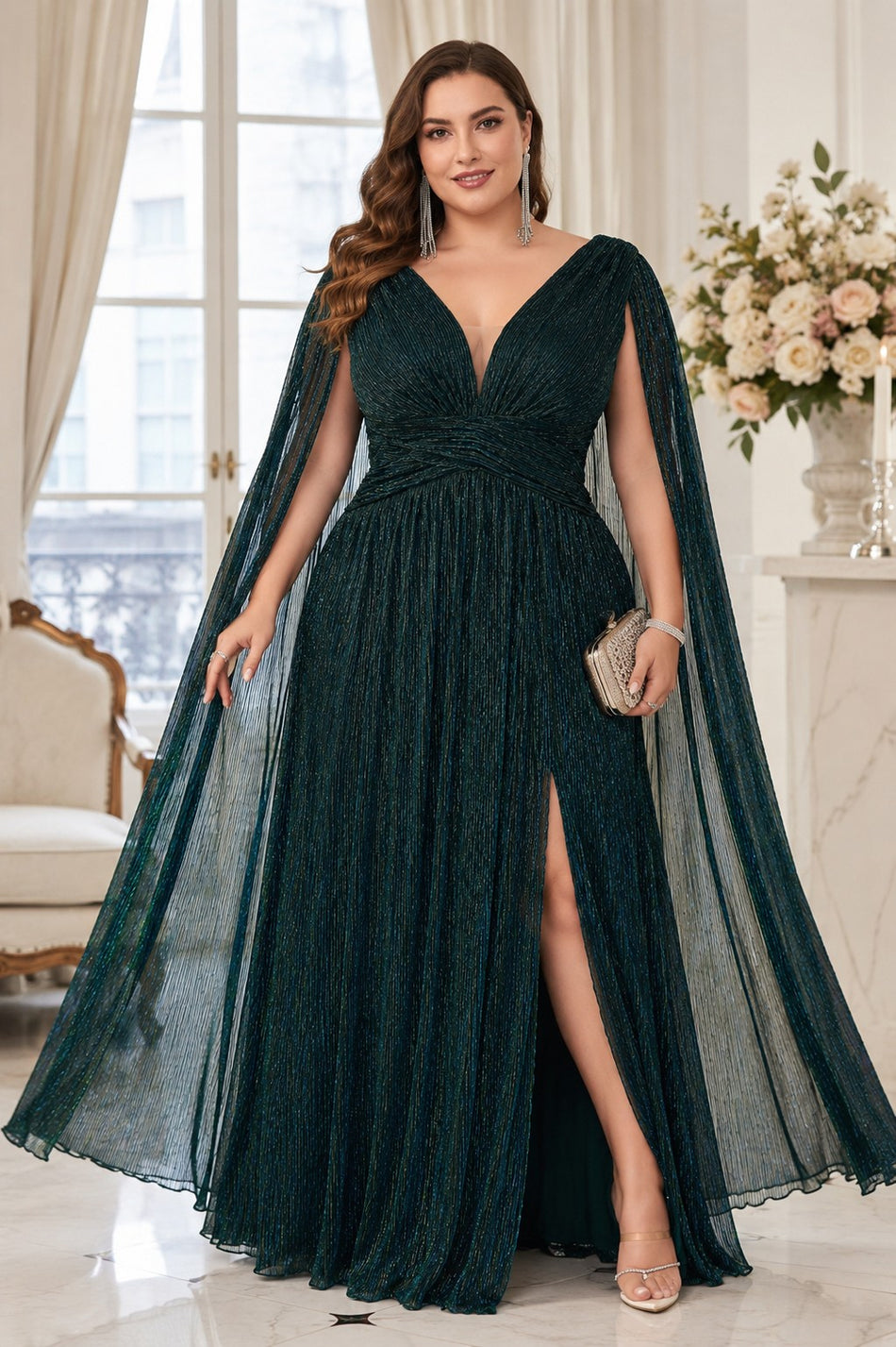 Plus size emerald green evening dress with Grecian draped bodice, deep V-neckline, crossover waist, cape sleeves and flowing floor-length skirt.