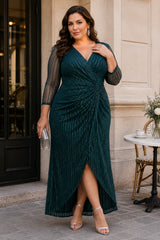 Plus size woman wearing an emerald green wrap midaxi formal dress with V-neck, gathered waist and sheer 3/4 sleeves.