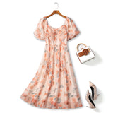 Plus size peach floral midi dress with puff sleeves and shirred bodice