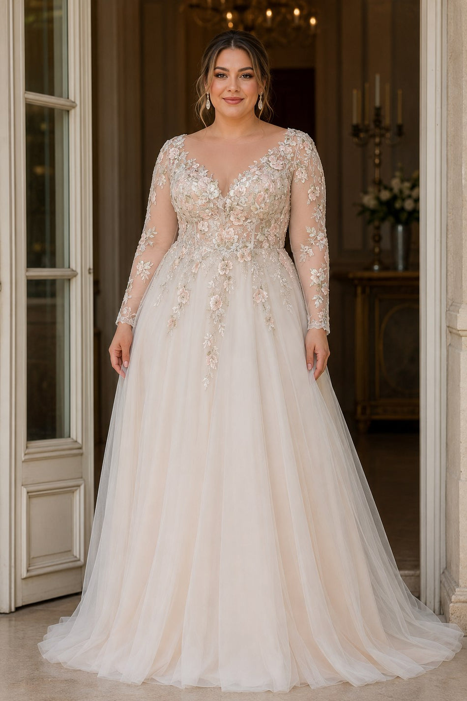 Front view of a plus size floral wedding dress with embroidered bodice, V-neckline, long illusion sleeves and flowing full-length skirt.