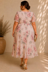 Plus size floral midi dress with flutter sleeves, wrap neckline and flowing A-line skirt back view