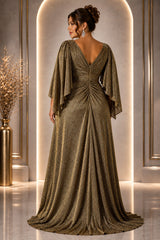Back view of a plus size woman wearing a gold evening maxi dress with V-back, flowing sleeves and gathered waist detail.
