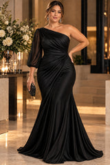 Plus size black one shoulder evening gown with sheer three-quarter sleeve and draped waist, front view.
