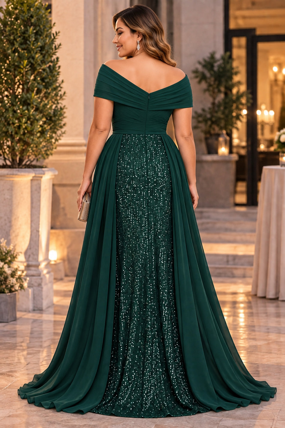 Back view of plus size green sequin evening gown with off-shoulder neckline and flowing skirt