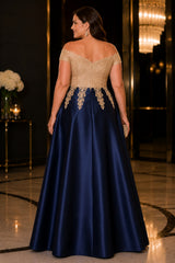 Back view of plus size navy evening dress with champagne lace off shoulder bodice and flowing A-line skirt