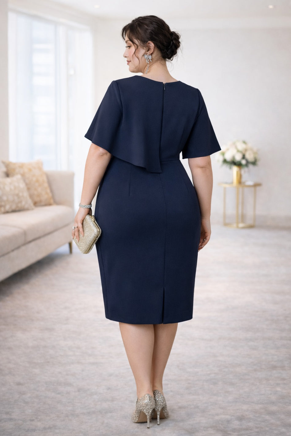 Back view of Plus Size Peplum Cocktail Dress in navy, suitable for cocktail events and formal occasions