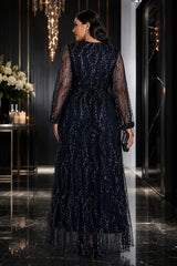 Back view of plus size navy sequin evening maxi dress with sheer embellished sleeves and flowing full-length skirt.