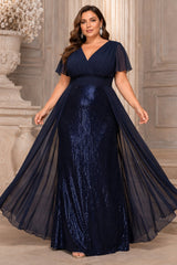 Plus size navy sequin evening gown with chiffon overlay, flutter sleeves and flattering wrap V-neck front view