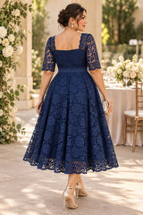 Back view of navy plus size lace midi dress with square back neckline and A-line skirt.
