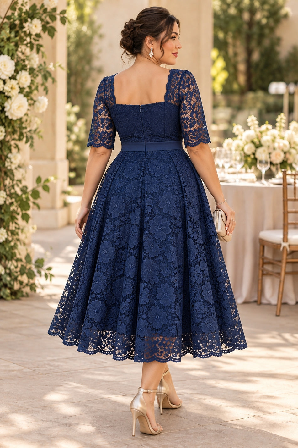 Back view of navy plus size lace midi dress with square back neckline and A-line skirt.