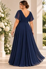 Back view of a plus size woman wearing a navy maxi formal dress with V-shaped back, flutter sleeves and flowing A-line skirt.