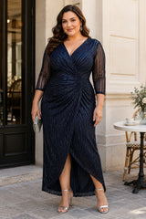 Plus size woman wearing a navy wrap midaxi formal dress with V-neck, gathered waist and sheer 3/4 sleeves.