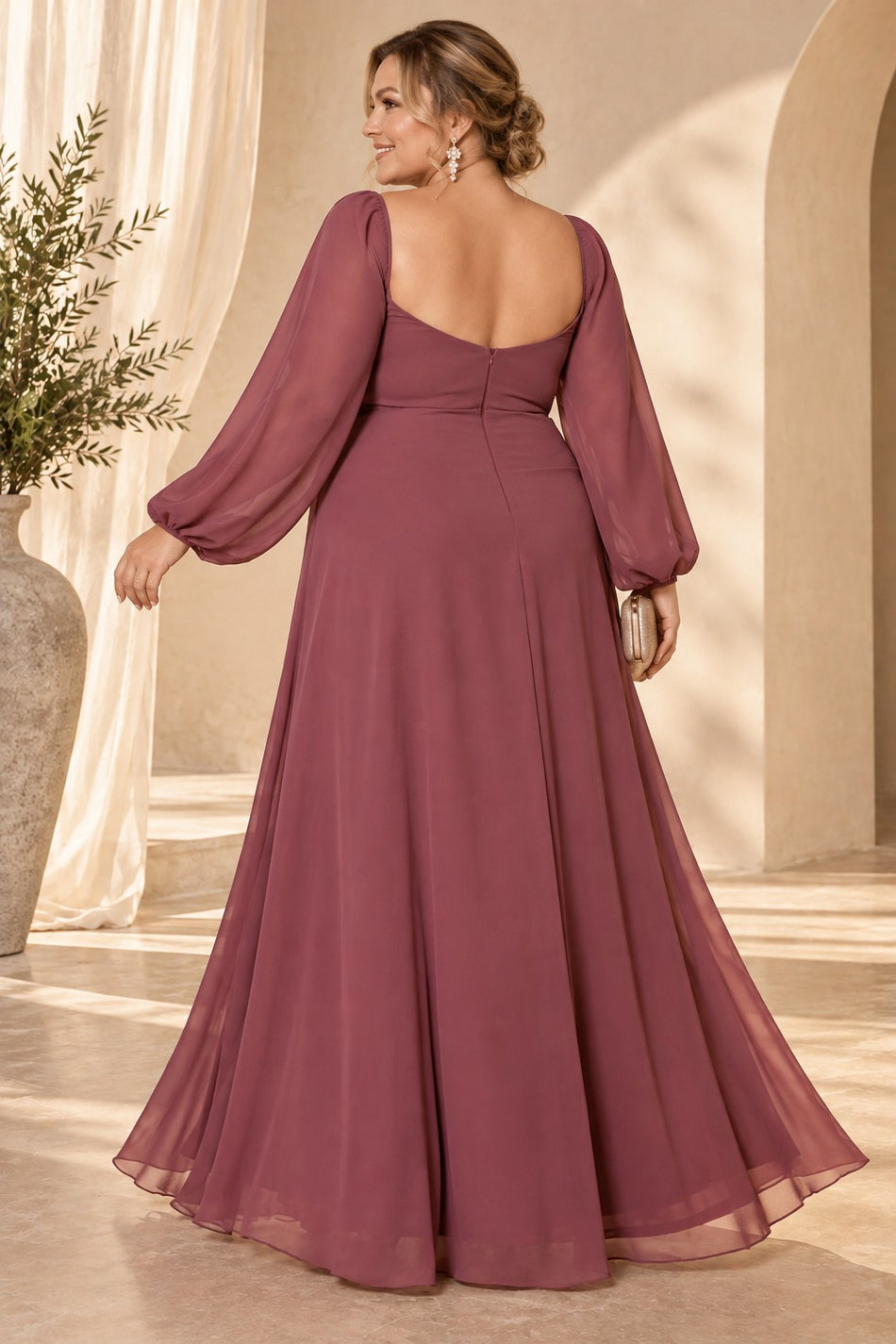 Back view of a dusty rose pink plus size evening maxi dress with low square back, long sheer sleeves and flowing A-line skirt.