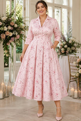 Plus size pink floral midi shirt dress with three-quarter sleeves, side pockets and full A-line skirt