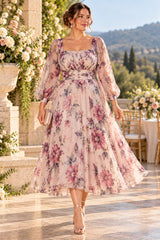 Plus size pink floral wedding guest dress with square neckline, three-quarter sleeves and tea-length skirt, front view.