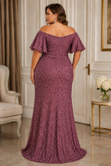 Back ALT Text
Back view of a plus size pink sequin formal maxi dress with off-shoulder neckline, flutter sleeves, fitted silhouette and gently flared floor-length hem.