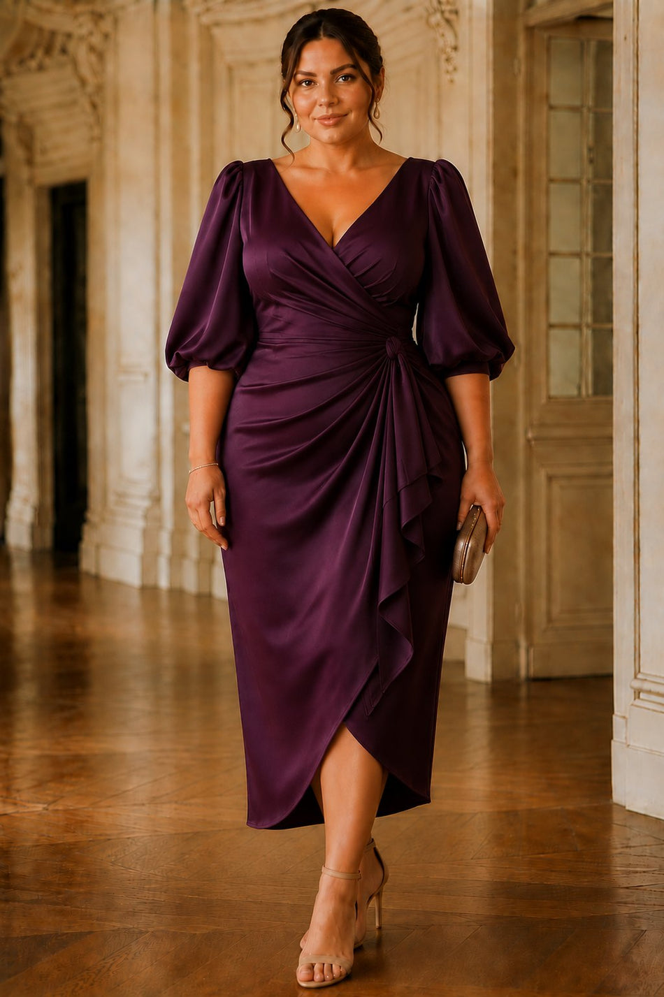 Front view of the Elise plum plus size cocktail midi dress featuring a wrap V-neckline, elbow-length puff sleeves, gathered waist and tulip midi skirt.