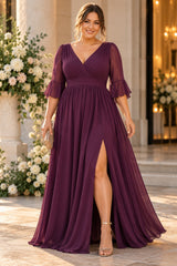 Plus size woman wearing a purple chiffon formal maxi dress with wrap V-neck, 3/4 flutter sleeves and flowing skirt.