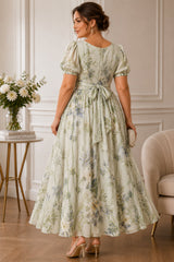 Plus size sage floral maxi dress with wrap neckline, puff sleeves and flowing A-line skirt back view