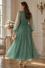 Back view of plus size sage green chiffon maxi dress with wrap V neckline, sheer long sleeves and flowing full-length skirt.