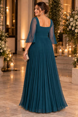 Back view of a teal plus size formal dress showing the square back neckline, centre-back zipper and pleated skirt.
