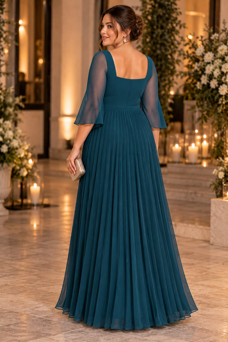 Back view of a teal plus size formal dress showing the square back neckline, centre-back zipper and pleated skirt.