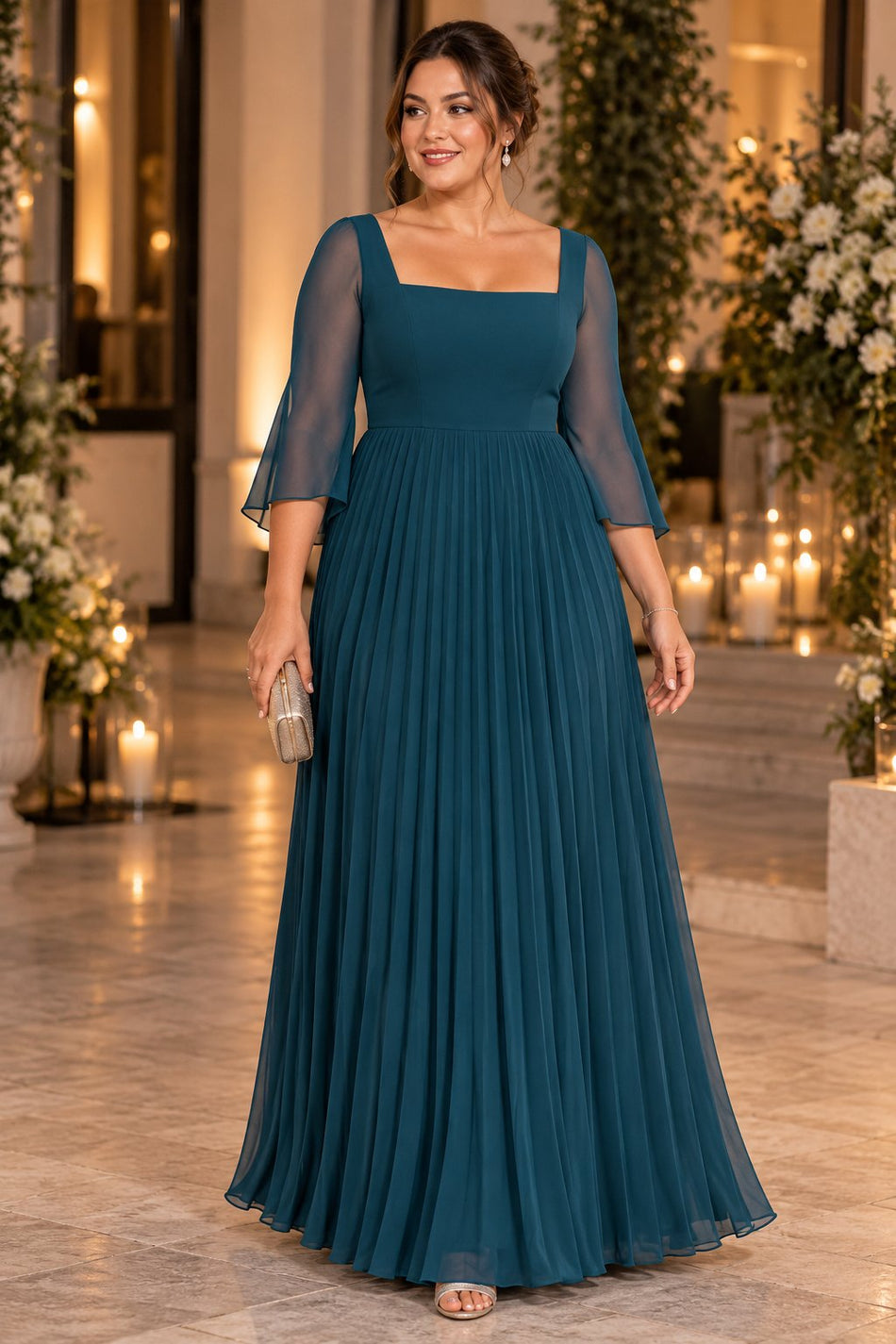 Woman wearing a teal plus size formal dress with sheer three-quarter sleeves, a square neckline and pleated maxi skirt.