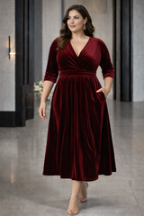 Plus Size Velvet Wrap Midi Dress in deep wine red velvet, suitable for wedding guests and evening events 