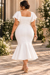 Back view of plus size white mermaid midi cocktail dress with square back neckline and flutter sleeves.