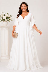 Front view of the white plus size formal chiffon maxi dress with flattering V-neckline, flowing angel sleeves and layered maxi skirt.